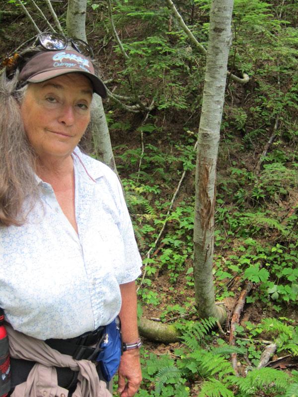 Linda Jo Hunter smiling in the woods